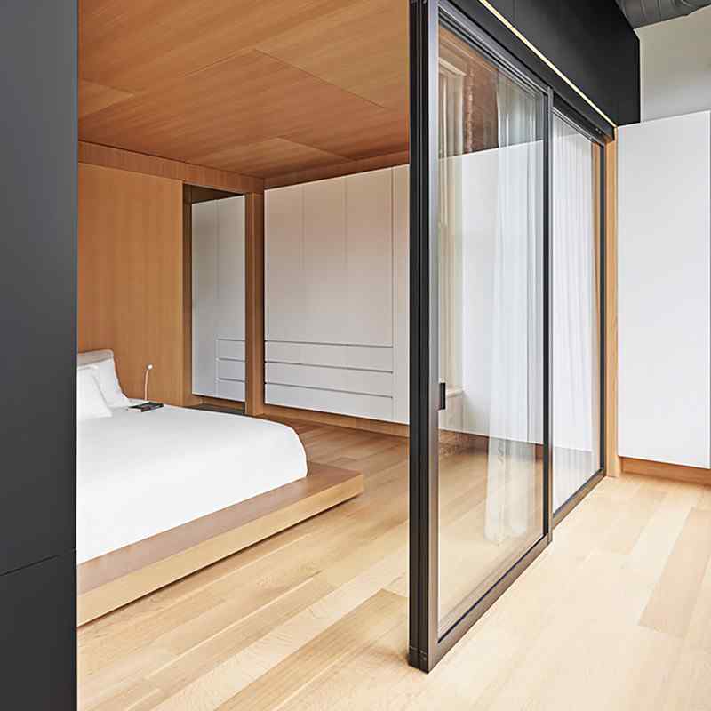modern bedroom with suspending sliding door panels