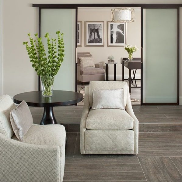 Frosted glass sliding door divides living room space area