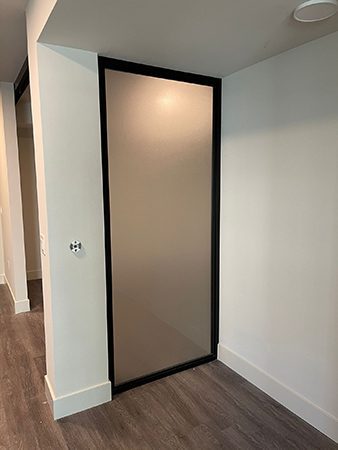 Frosted glass door with brown frames