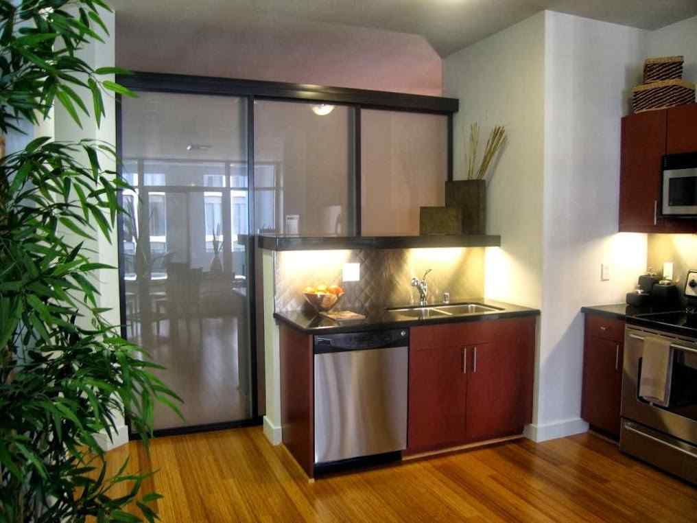 Glass Room Dividers in an Apartment Kitchen