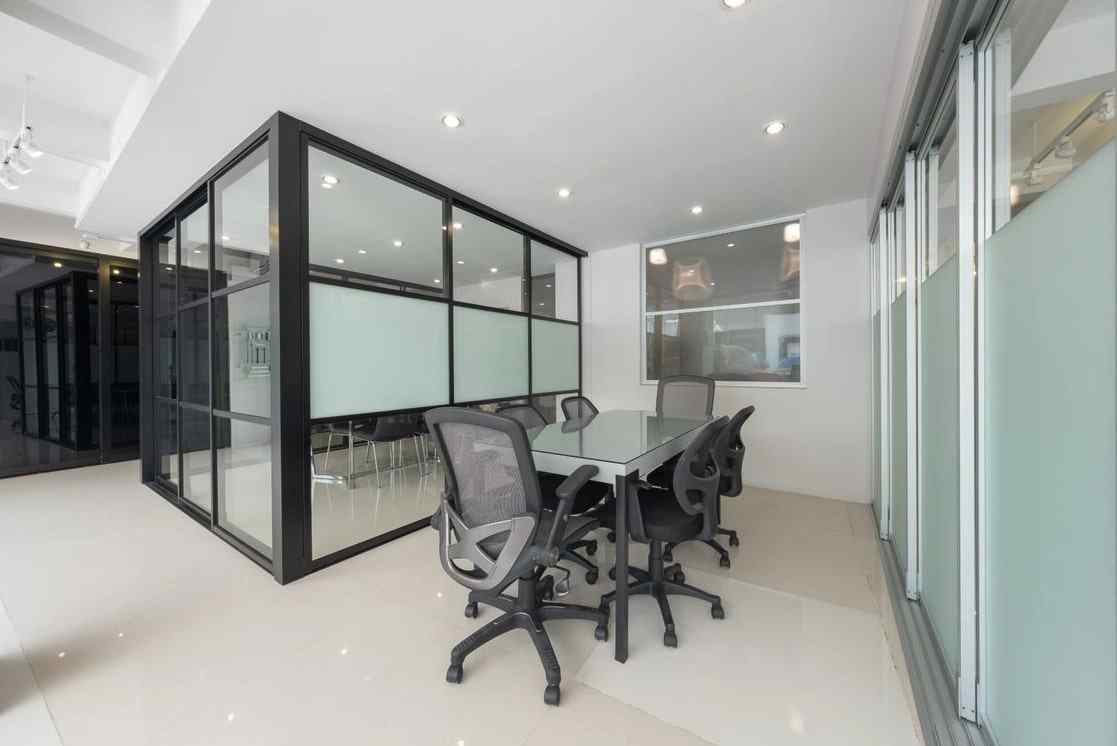 L shaped glass doors and glass walls office with clear and frosted glass