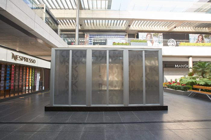 Frosted glass sliding door kiosk booth in Mexico City