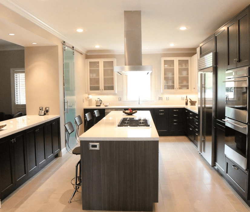 Glass barn door divides kitchen space 