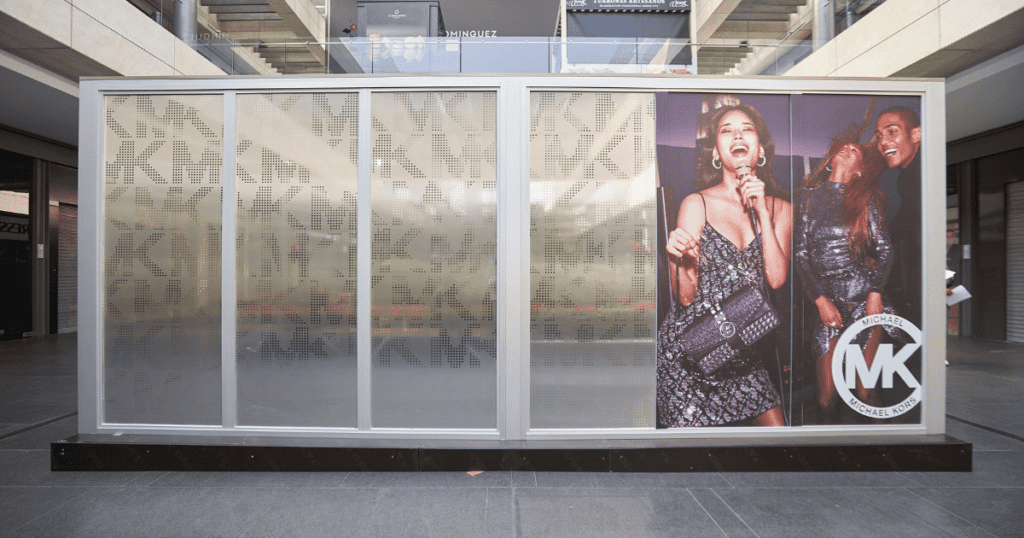 exterior of pop up retail kiosk for Michael Kors