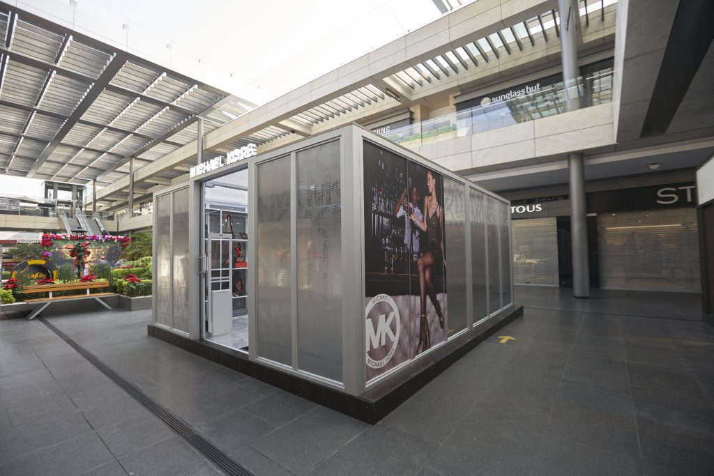 retail kiosk with doors open to shopping interior