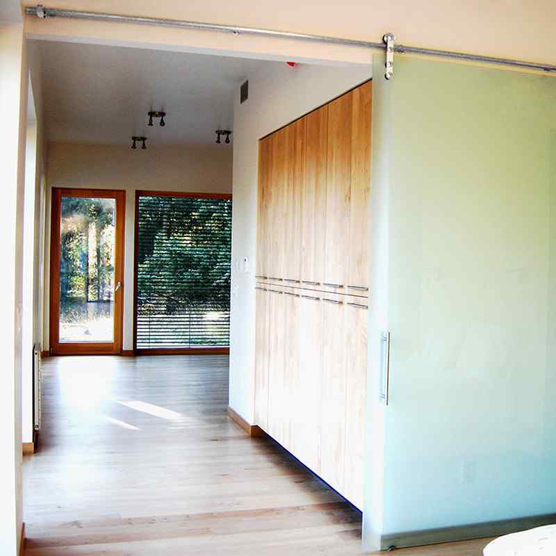 bedroom with high-end frameless glass barn door