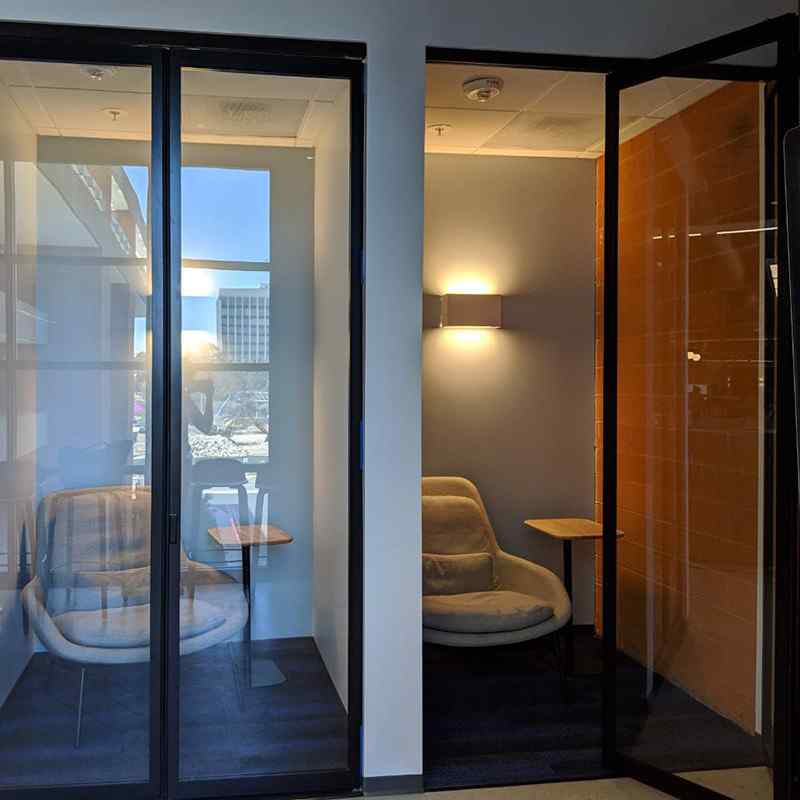 Bi-folding door phone booth style private room