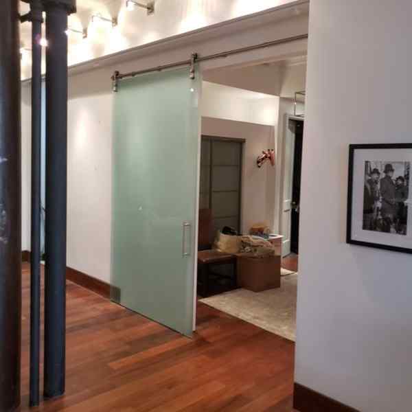 frameless barn door glass room divider