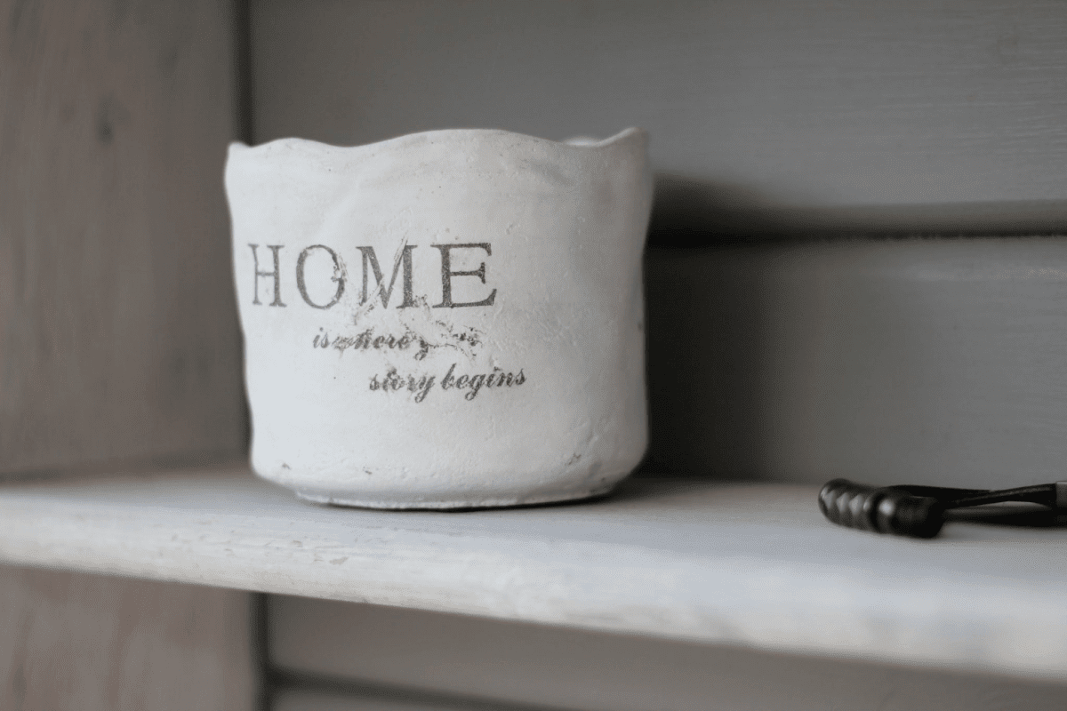 cup with a sign on the shelf