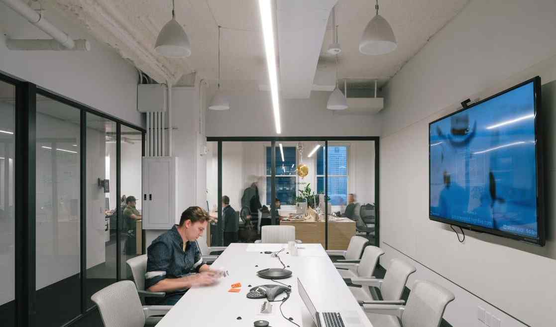 office conference room with glass fixed wall panels and bypassing slide door