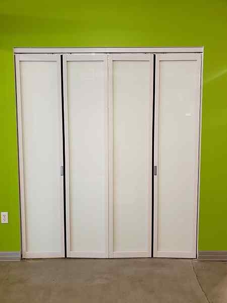 phonebooth bi fold bifold glass doors white frame
