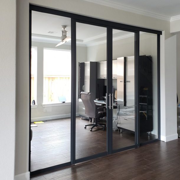 Clear glass suspended door space divider